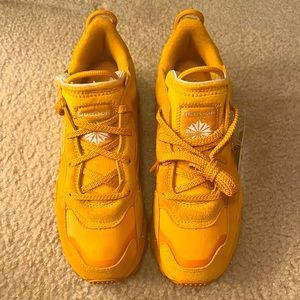 Cardi B tanish yellow Reebok shoes